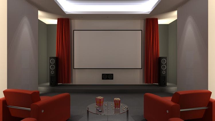 Stock image of home theater with red curtains across screen, chairs, and popcorn buckets