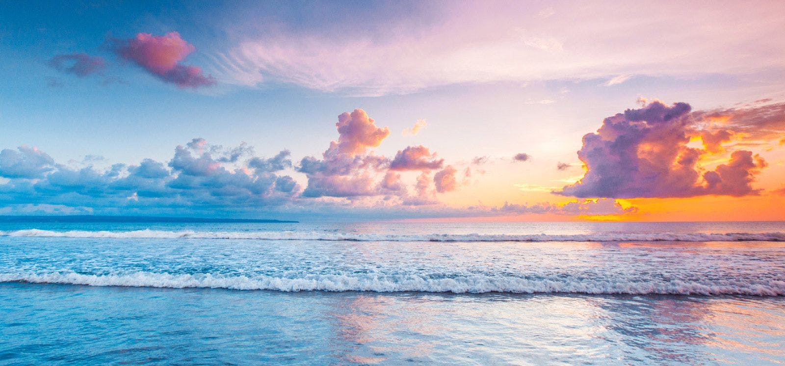 Soft pastel-colored sky over the sea