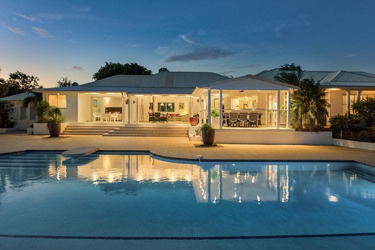 Simpson Bay vacation rentals with private pools - Sol e Luna luxury villa at dusk with pool