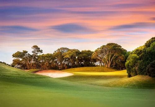 A golf course at sunset