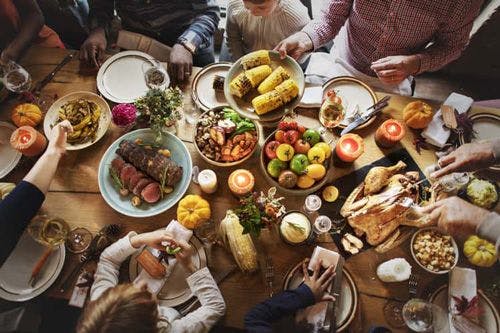 A table laden with Thanksgiving dishes