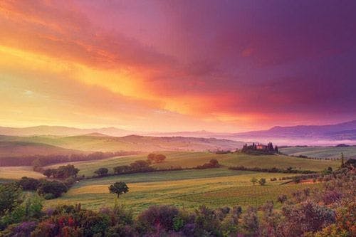 Sunset over a beautiful landscape in Tuscany