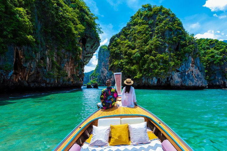 The best Thailand holidays, couple on a tourist boat taking in the view, Top Villas