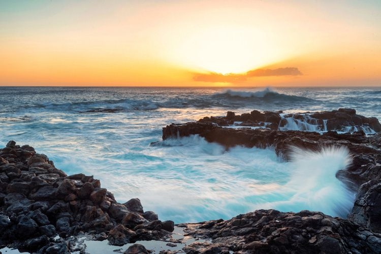Sunset over a rocky Hawaiian coast
