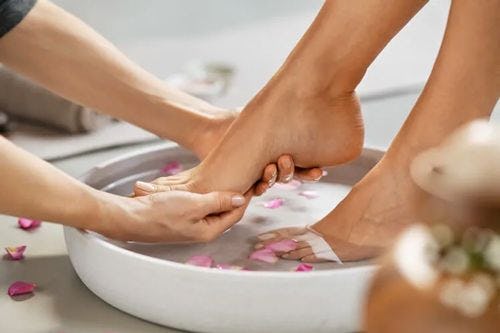 A person getting a foot bath at a spa