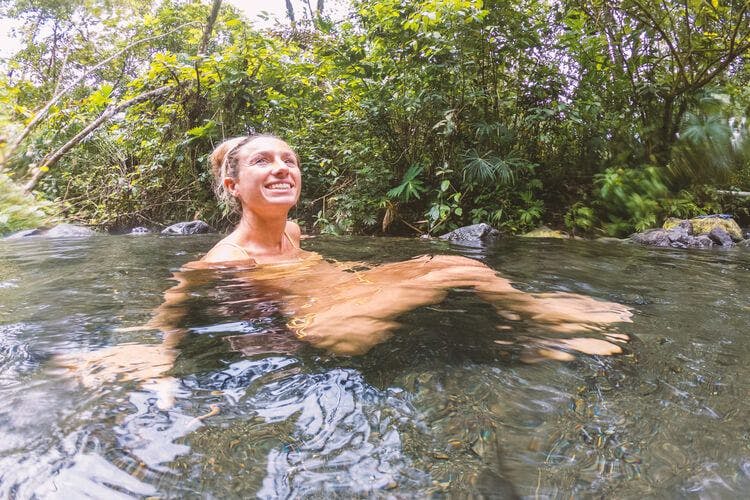 A lady enjoys the hot springs in Costa Rica