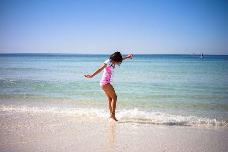 Things to do Gulf Place, Florida, girl enjoying the beach
