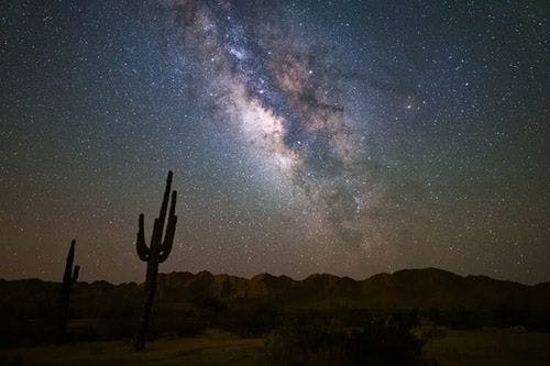 The Arizona landscape under the spiral arm of the Milky Way at night