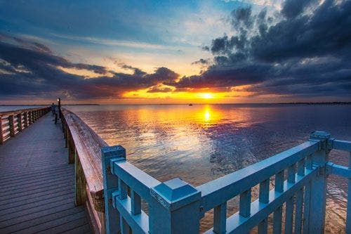 Sunset view of Bayshore Live Oak Park pier