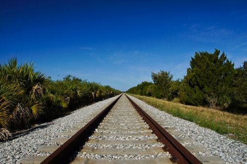 Long railroad tracks stretching off to the horizon