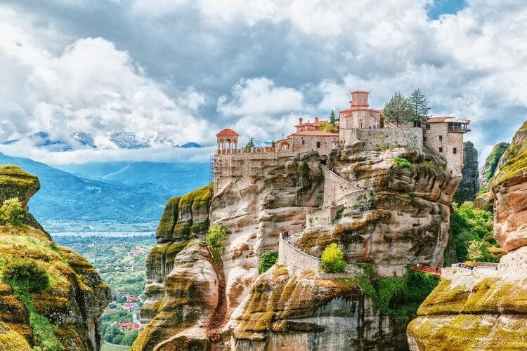 Meteora monasteries balancing on top of rock peninsulas in Greece