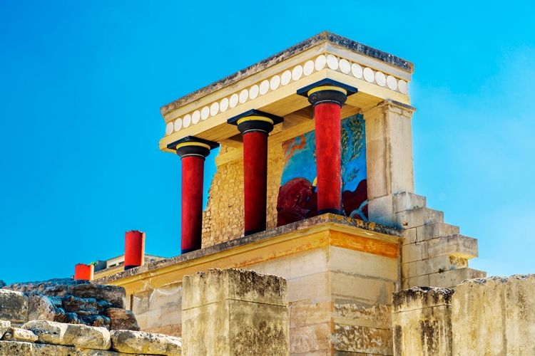 Ruins of the Palace of Knossos in Crete, a temple with red columns