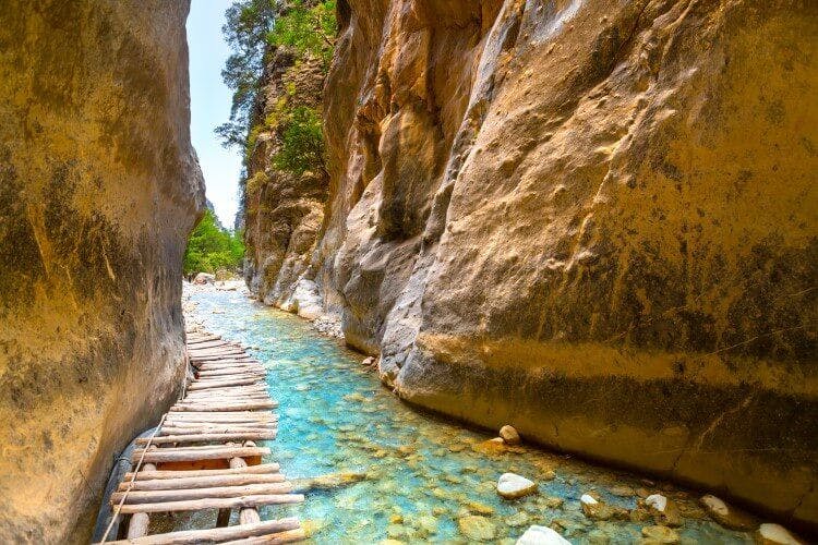A shallow river flowing through Samaria Gorge in Crete, Greece