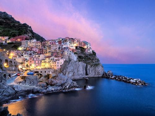 Cinque Terre seafront town at sunset