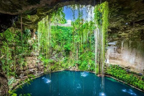 An underground lake in Mexico with a whole in the ceiling