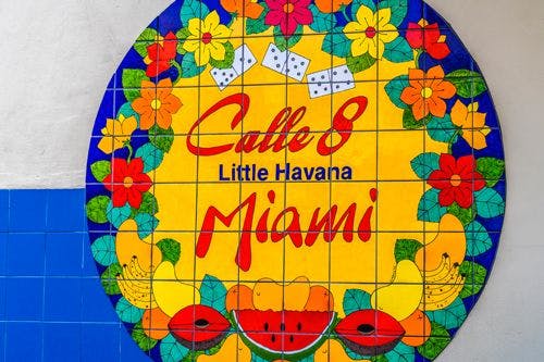 Mosaic sign with colorful fruit images saying Calle 8 Little Havana Miami