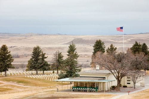 American flag, cemetery and information center at Little Bighorn Battlefield Memorial