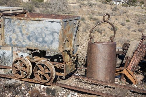 Old mining cart and equipment on rails