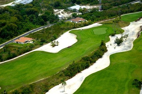 Aerial view of golf course with white sand bunkers