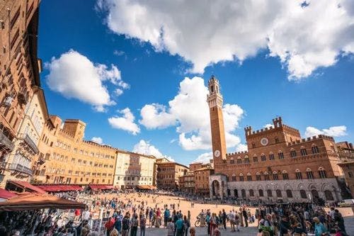 The Piazza of Siena with a tall tower and city hall