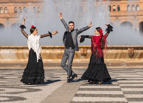 Three flamenco dancers on the streets of Seville