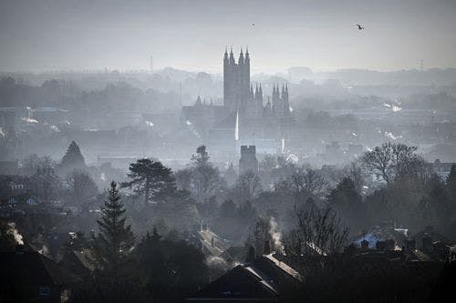 A misty morning in Canterbury, with the cathedral spires soaring above the city