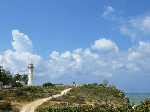 Lighthouse on a rocky point on Grand Turk island