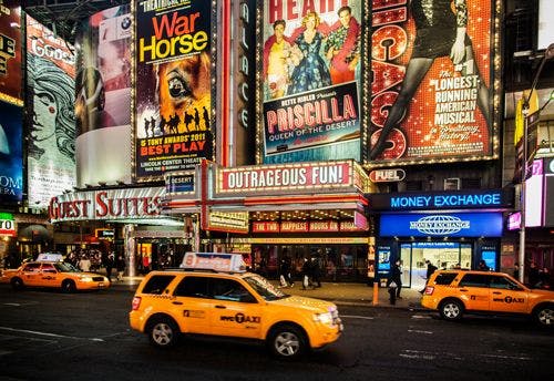 Times Square in Manhattan with yellow cabs and Broadway billboards