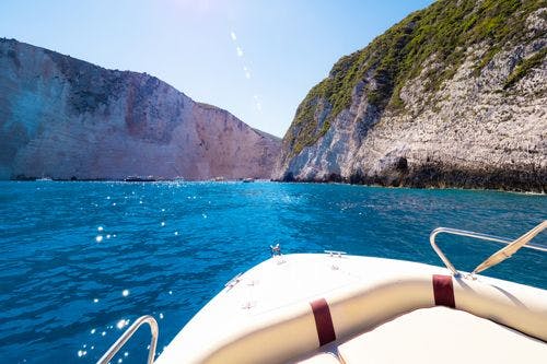 View from the front of a boat approaching a cove beach in Zante