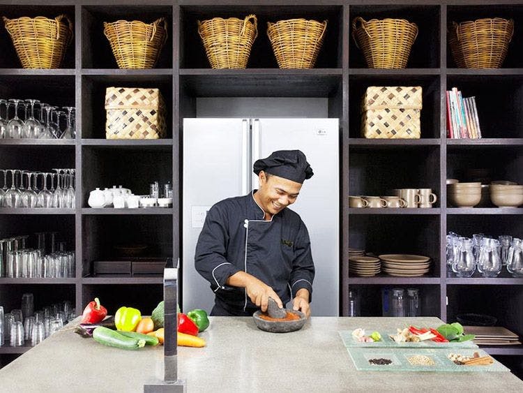 A chef works in a private kitchen