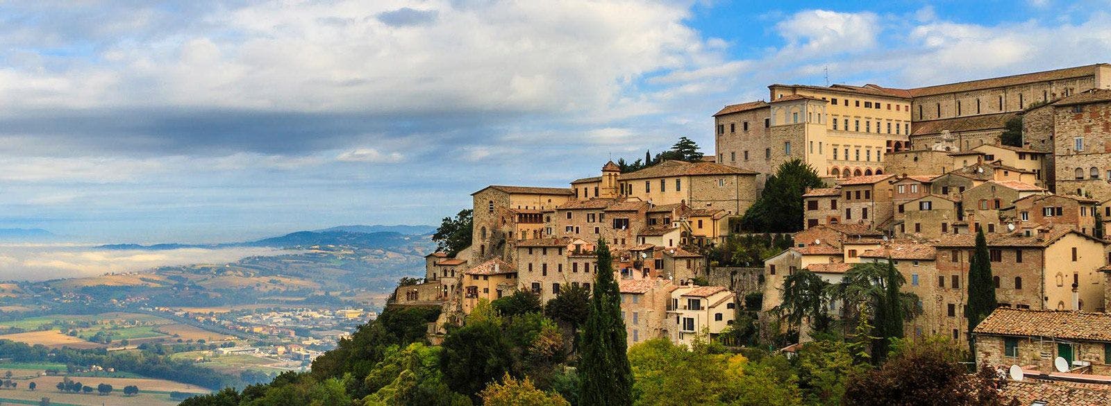 A hilltop town in Umbria overlooking patchwork fields
