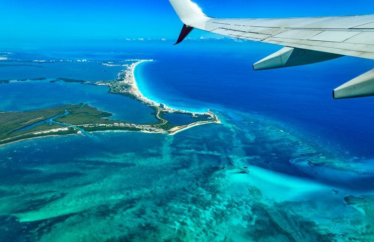 View of Cancun and reef from a plane windown