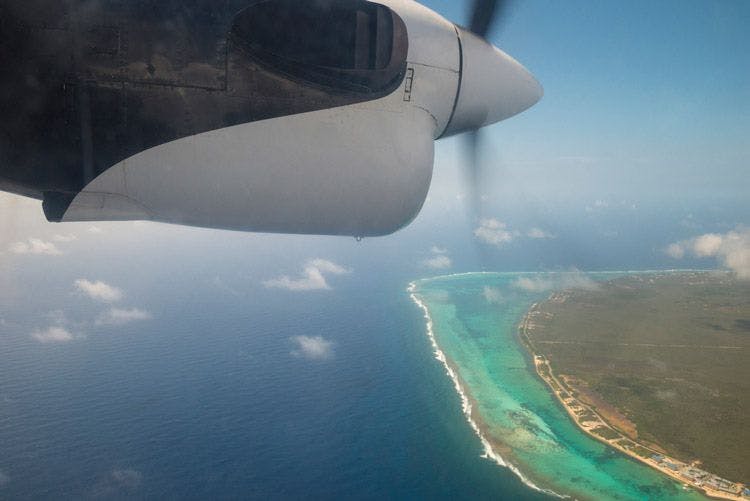 View from propeller plane window of the Cayman Islands coast