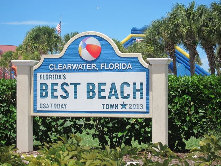 Clearwater sign reading 'Florida's Best Beach' with an image of a striped beach ball