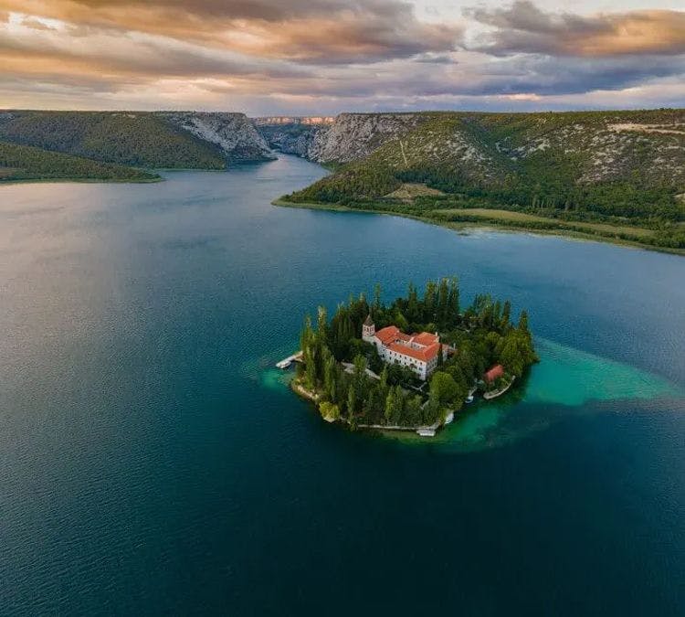 A small island with a church in a lake in Dalmatia