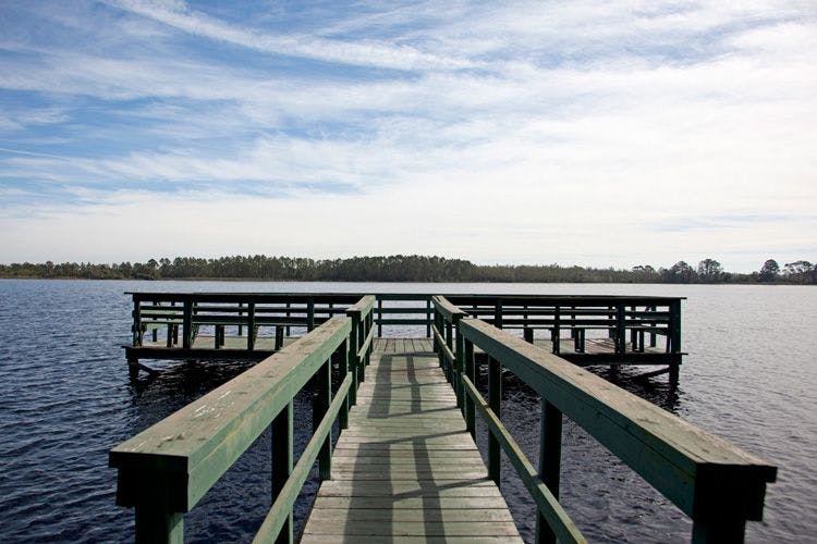 Wooden pier into lake