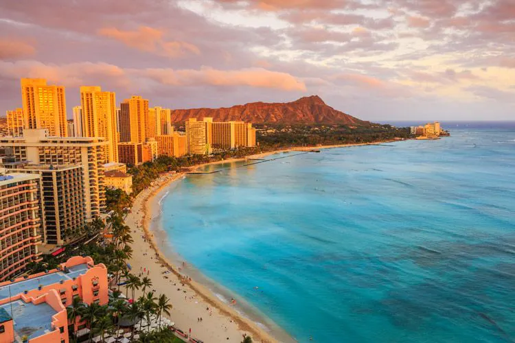 Honolulu city skyline and Waikiki Beach at sunset