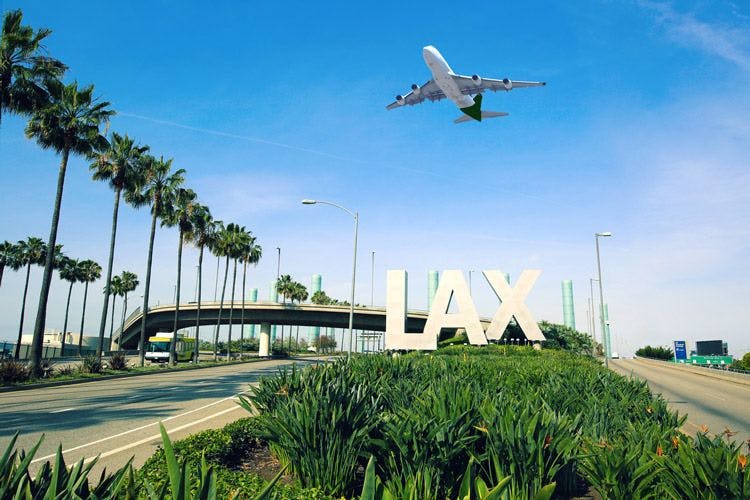 A plane landing at LAX Airport