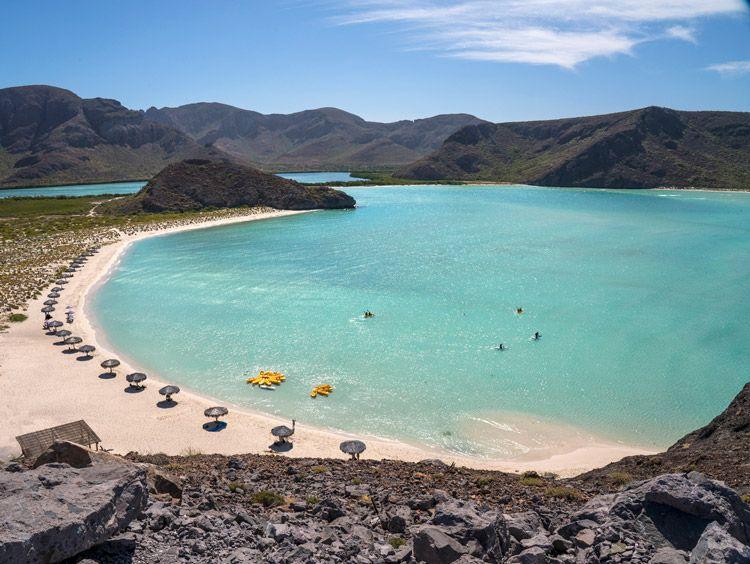 White sand beach in a rocky cove in La Paz