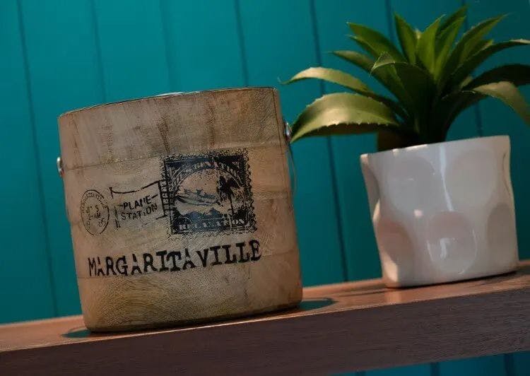 Margaritaville sign on a small wooden table