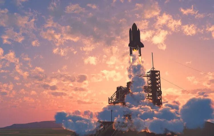 A space shuttle blasting off at sunrise