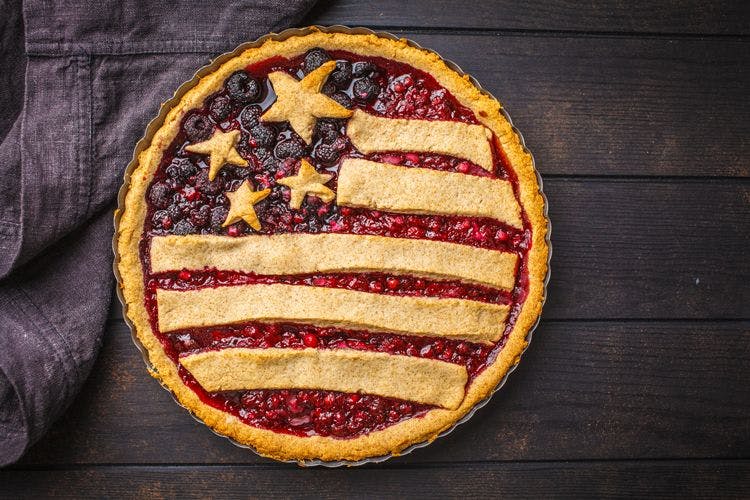 A blueberry and raspberry pie decorated with pastry in the form of the American flag