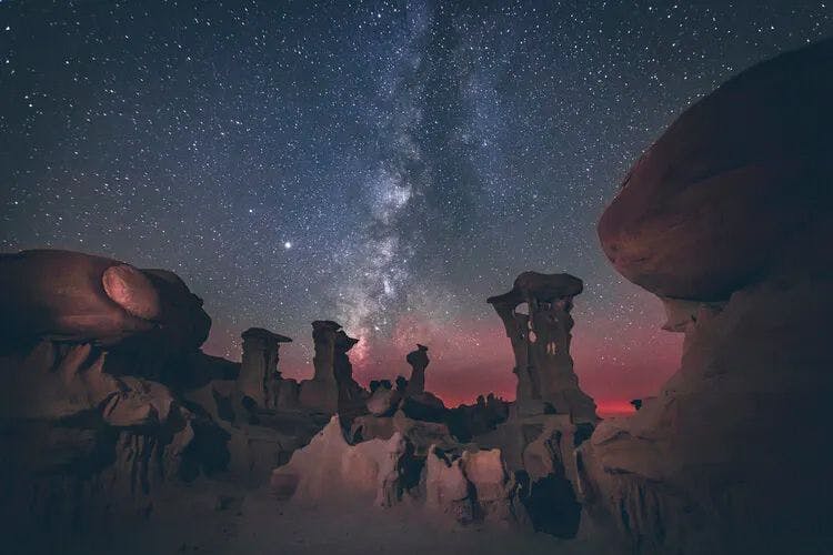 Rock formations under a tsar-studded night sky in the New Mexico desert