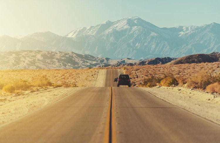 A straight road through the California desert near Palm Desert