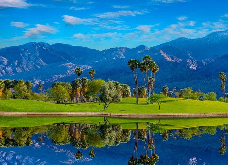 A Palm Springs golf course with mountains behind