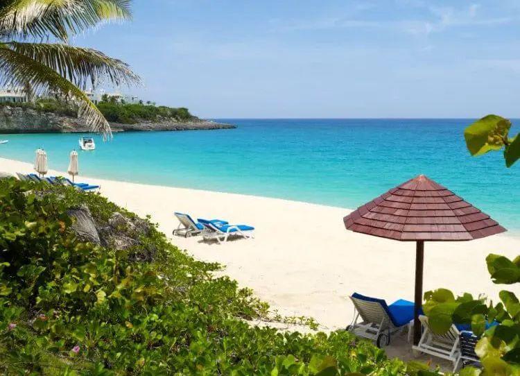 White sand beach with sun loungers and parasols