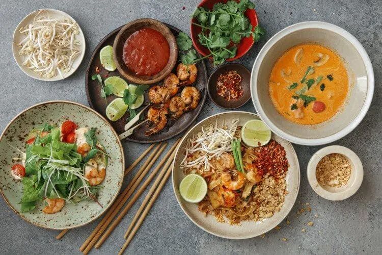An overhead shot of various Thai dishes 