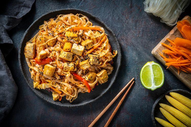 Plate of Pad Thai on a black table