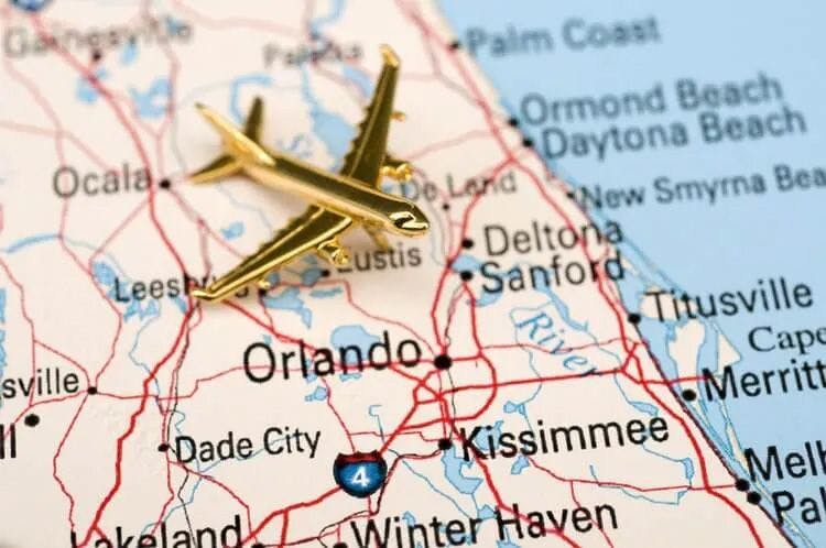 A gold plane model on a map of Orlando