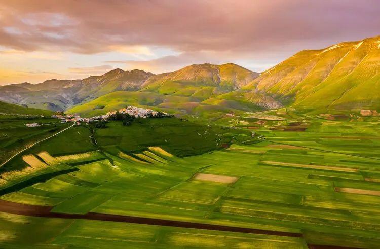 Umbria landscape of farmed fields with mountains